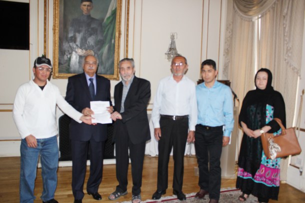 Pakistani High Commissioner being presented with the Petition.